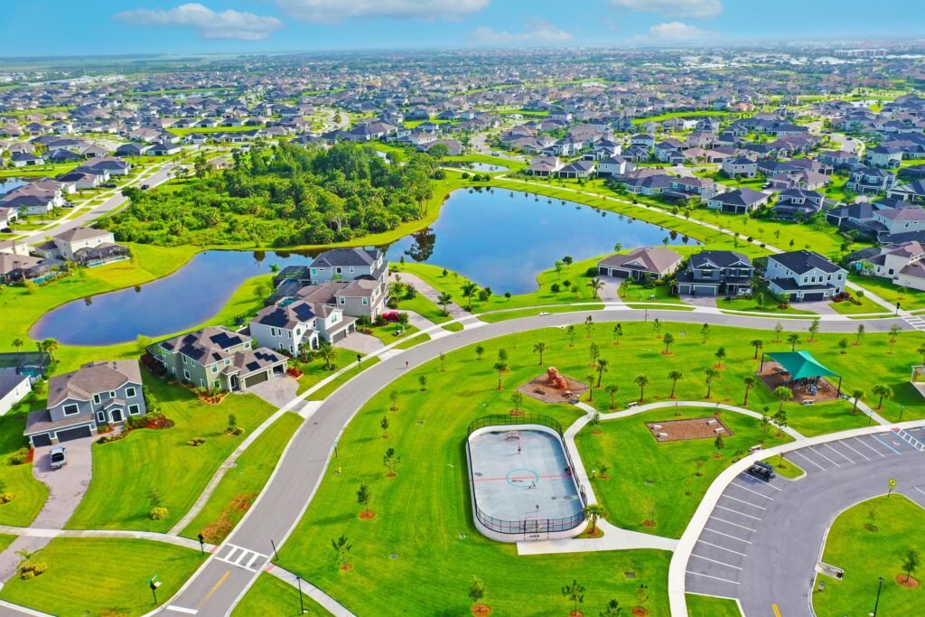 Scenic aerial view of family-friendly neighborhoods and lakes showcasing modern homes for sale in Viera, FL